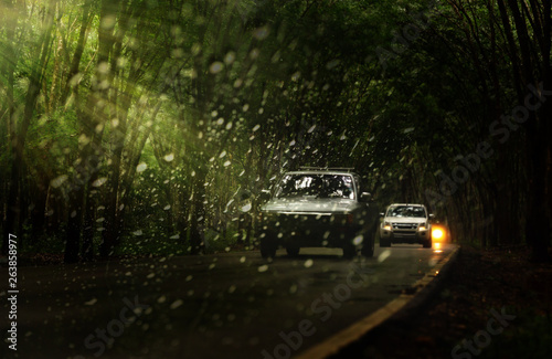 Water drops.View through the windshield of strong rainy day ,Shallow depth of field composition.