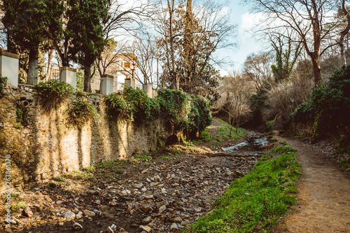 Bridges across the former moat in the park of the old city in Girona, Spain