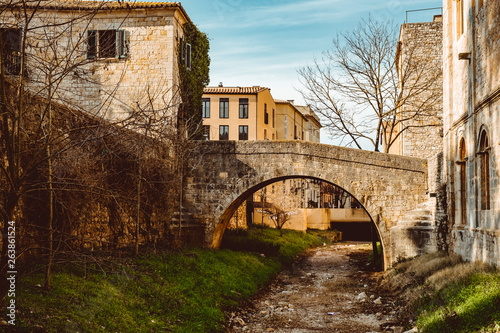 Bridges across the former moat in the park of the old city in Girona  Spain