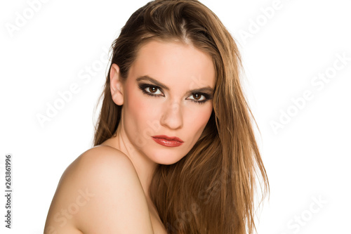 Young shirtless woman with makeup, posing on white background