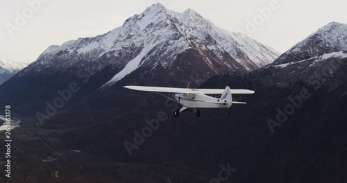 Airplane flies over Alaska wilderness, aerial