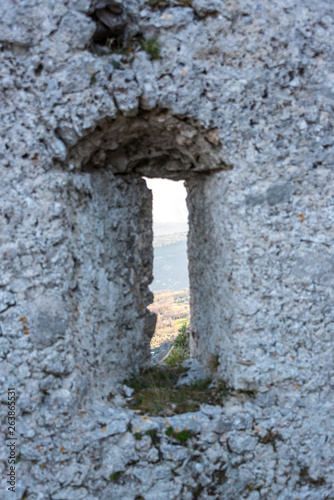 Fototapeta Naklejka Na Ścianę i Meble -  Looking out a Window in an Abandoned Medieval Village in Southern Italy
