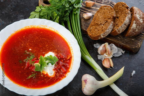 Vegetable soup with beets, rustic style, selective focus.