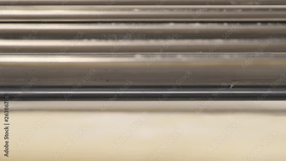 A closeup demonstration video of the laminated dough rolling out by the dough sheeter machine