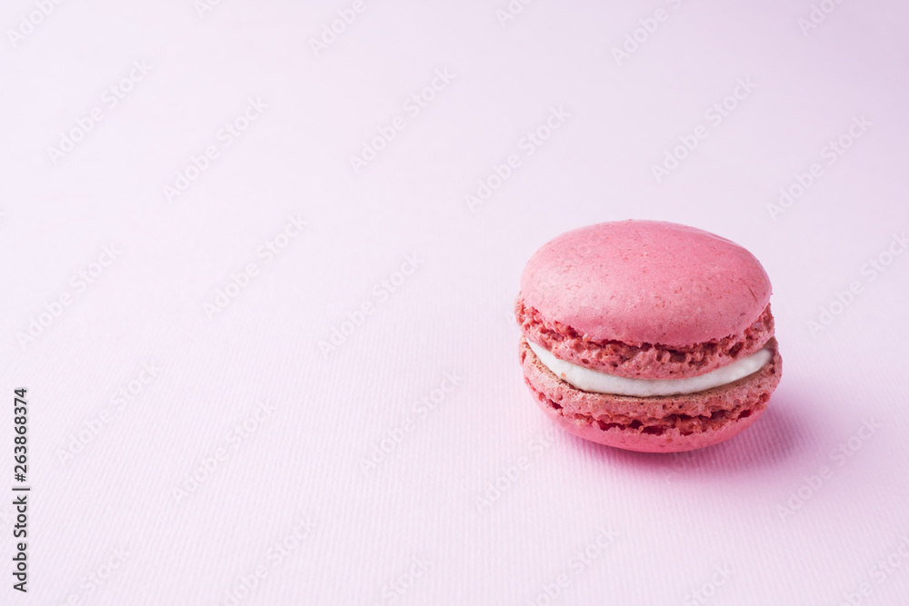 Pink dessert macaron or macaroons on pink background. Selective focus. Copy space Pink dessert macaron or macaroons on pink background. Selective focus. Copy space