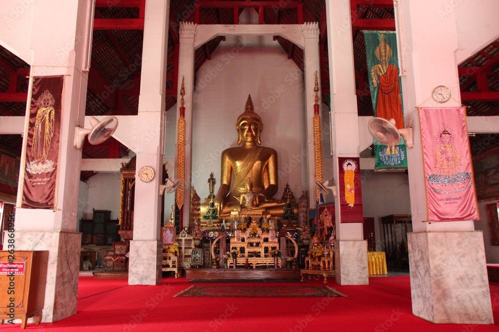 altar and satue of buddha in a buddhist temple (Wat Phra Kaew Don Tao) in Lampang (Thailand)