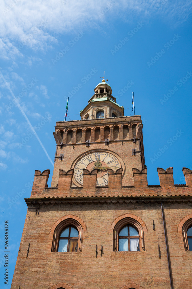 tower with clock of Palazza d'Accursio in Bologna, Italy