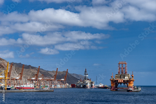 Oil rig platform at dawn in the port of Santa Cruz de Tenerife Canary Islands Spain. Anaga mountains in background