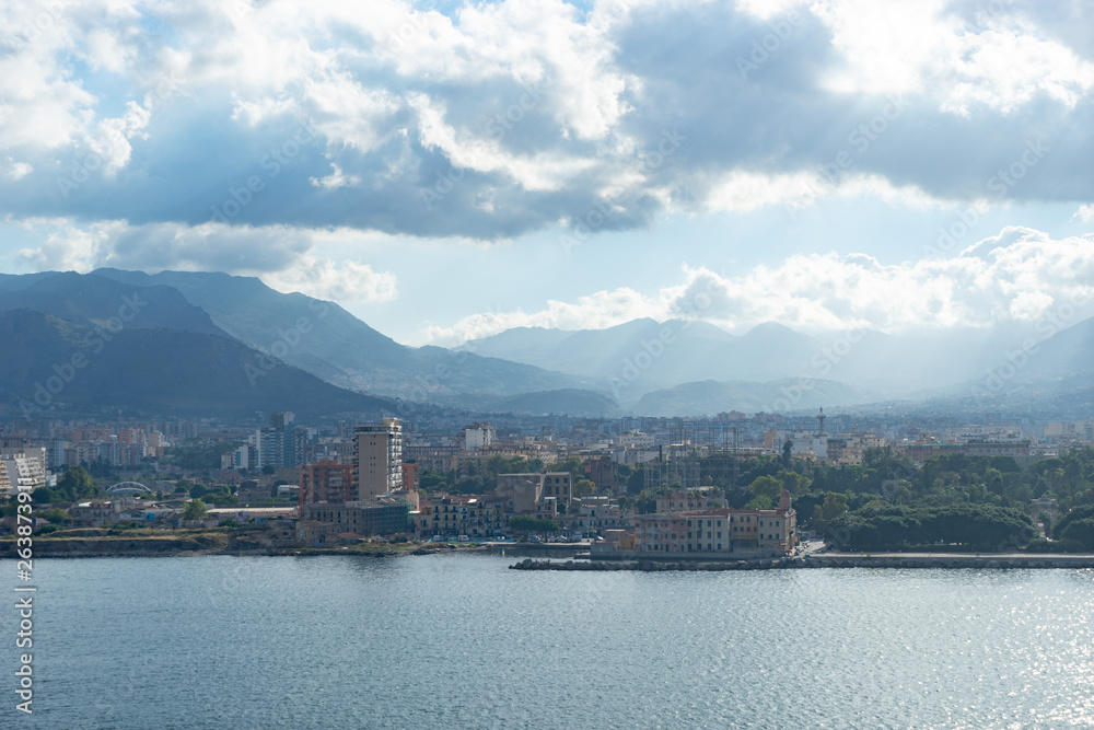 Aerial view from the sea of Palermo with mountains and clouds on background