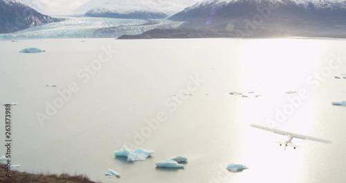 Plane flies over Alaska environment, aerial