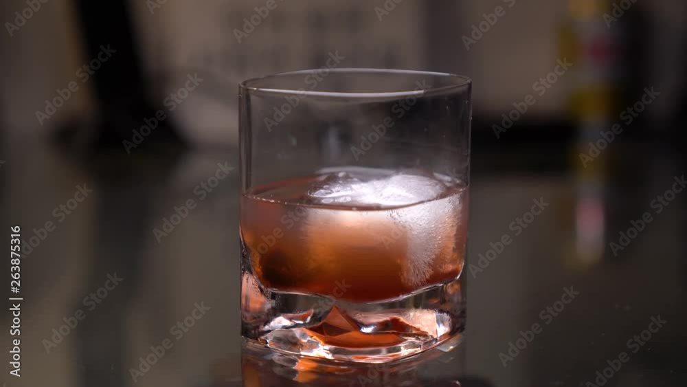 Old Fashioned served in a bar, showing the cocktail ready to be served.