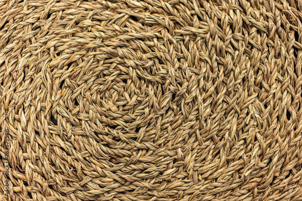 Woven yellow wicker straw background or textur Woven yellow wicker straw background or textur