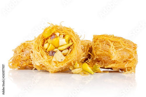Group of five whole traditional sweet lebanese baklava piece bird nest variety isolated on white background