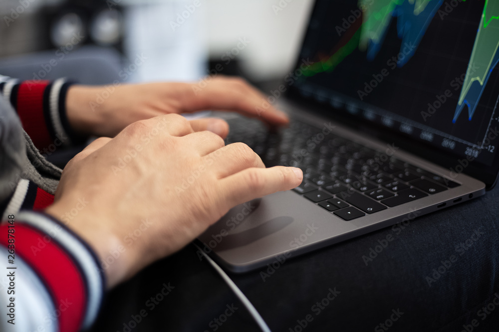 Close-up of man hands typing on keyboard and using touchpad of laptop. Analysis data of finance statistic. Close-up of man hands typing on keyboard and using touchpad of laptop. Analysis data of finance statistic.