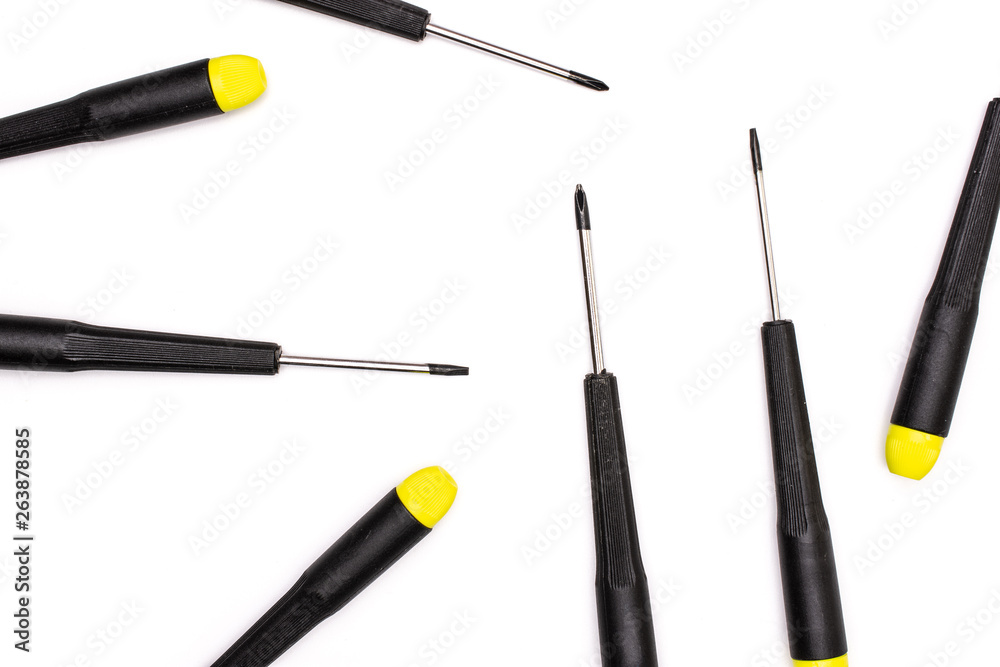 Group of seven whole screwdrivers with a yellow black plastic handle work item flatlay isolated on white background Group of seven whole screwdrivers with a yellow black plastic handle work item flatlay isolated on white background