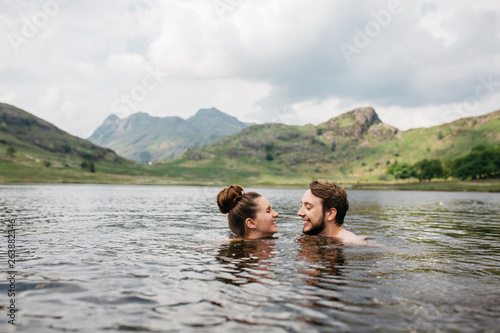 Couple swimming together