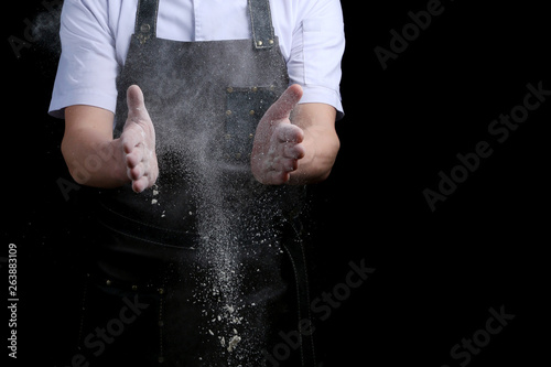 hands and flour in splash baker clap on black back
