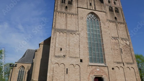 Facade of romanic church 'Bergkerk' in city of Deventer. This church was built between 1198 and 1209. The two spires ware added in the 15th century. photo