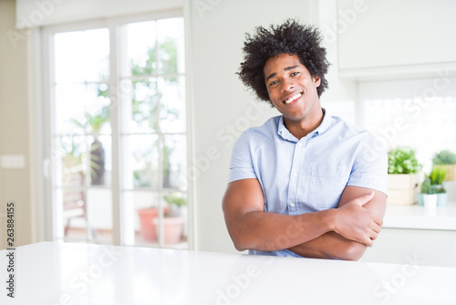 African American business man happy face smiling with crossed arms looking at the camera. Positive person.