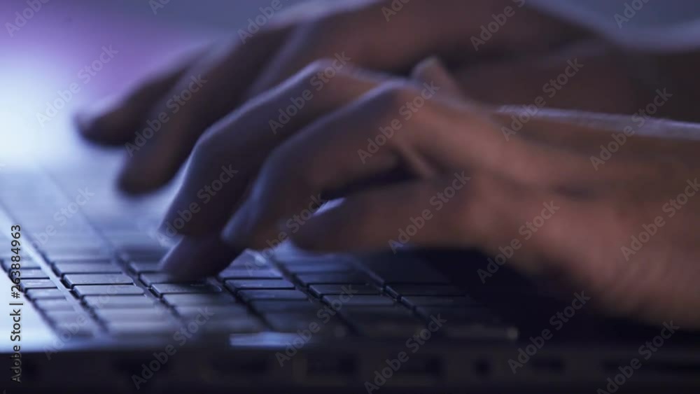 Hands typing on a laptop. Working from home