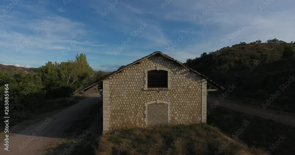 Recording with drone, of a building of the train station of Daroca in Zaragoza, Spain. The engraved building is the warehouse where the freight wagons were loaded. The train station is abandoned. Recording with drone, of a building of the train station of Daroca in Zaragoza, Spain. The engraved building is the warehouse where the freight wagons were loaded. The train station is abandoned.