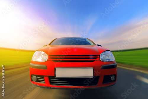 car in motion   driving speed blurred background