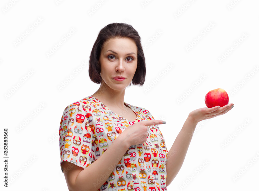 European woman doctor holds an apple in hand. photo session on a white background in the photo studio. The average plan. Portrait. Doctor nutritionist. European woman doctor holds an apple in hand. photo session on a white background in the photo studio. The average plan. Portrait. Doctor nutritionist.