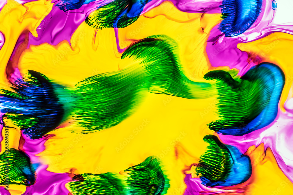 Background of red, pink, yellow, green ink waves