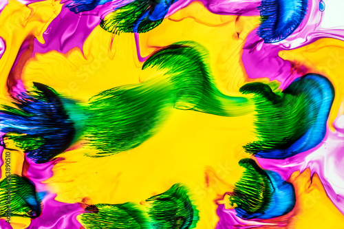 Background of red  pink  yellow  green ink waves