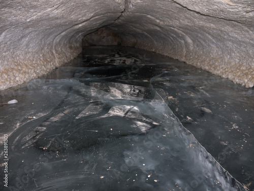 Fototapeta Naklejka Na Ścianę i Meble -  cave tunnel with ice floor, Pinega Nature Reserve, Arkhangelsk region, Russia