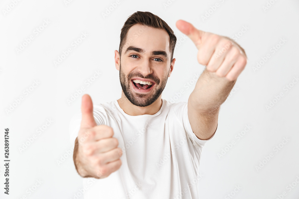 Handsome cheerful man wearing blank t-shirt Handsome cheerful man wearing blank t-shirt