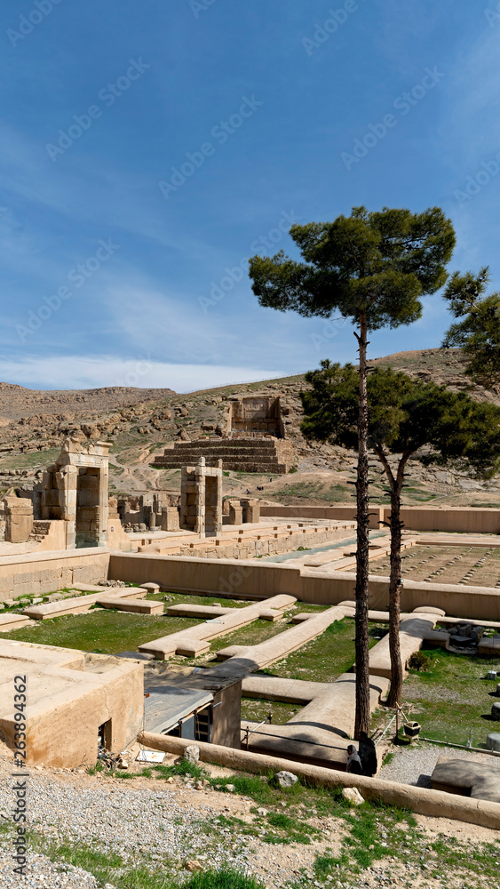 Ruins of a palace towards Rahmat Mountain. Persepolis, an ancient ceremonial capital of Persian Empire, in modern Iran Ruins of a palace towards Rahmat Mountain. Persepolis, an ancient ceremonial capital of Persian Empire, in modern Iran