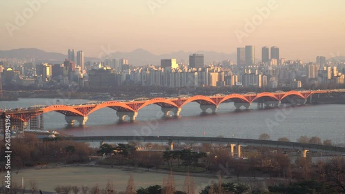 Red Seongsan bridge on sunset in Seoul , shot from Hanul Park, Seoul City View photo