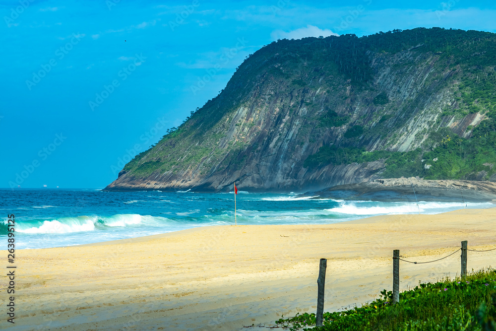 Stone beach and mountain. Beach paradise. Itacoatiara beach. City of Niteroi, State of Rio de Janeiro Brazil, South America. 