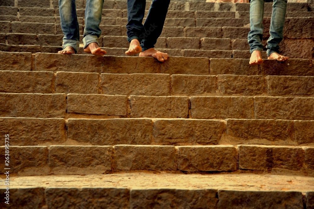 feet of man and woman on stone steps feet of man and woman on stone steps