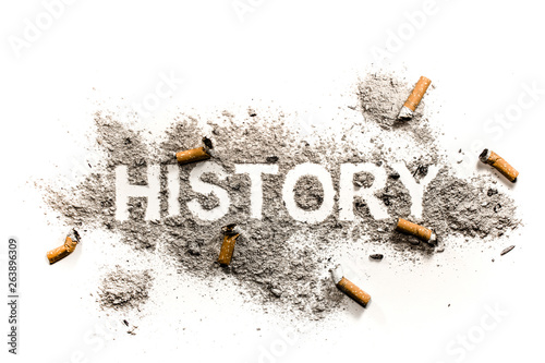 History word and cigarette butt in pile of ash photo