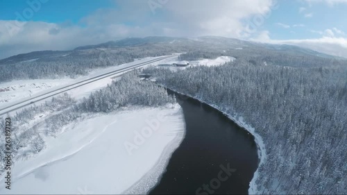Wallpaper Mural Drone view over a small frozen lake. The snow shines bright. See the highway in the background. Torontodigital.ca