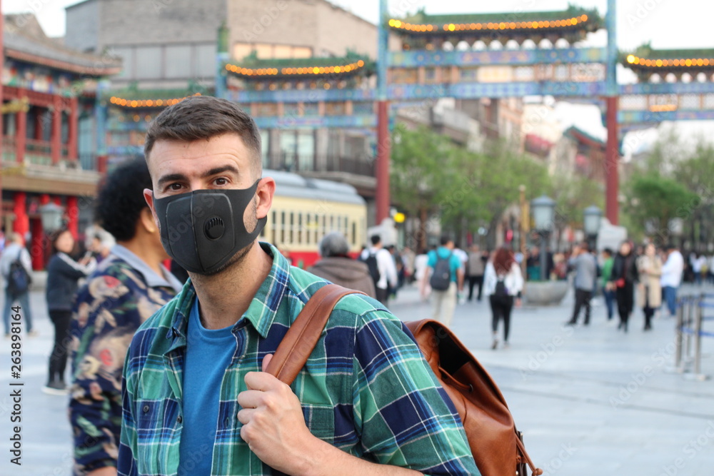 Man protecting his health with breathing mask
