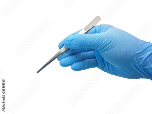 Hand of surgeon in blue medical glove holding a tweezers isolated on white background with clipping path