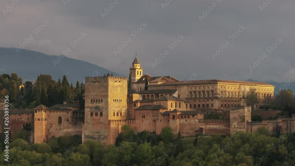 Sunset with the Alhambra of Granada as main subject. Beautiful clouds and Sierra Nevada in the background. Sunset with the Alhambra of Granada as main subject. Beautiful clouds and Sierra Nevada in the background.