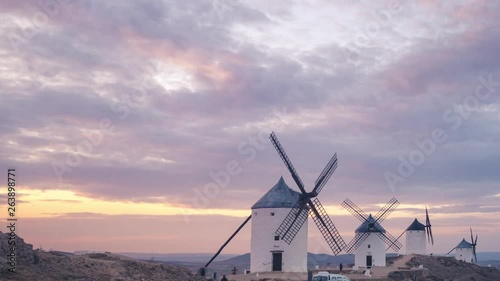 Windmills in Consuegra, Castilla La Mancha during sunset. Clouds with beautiful colors at golden hour.
