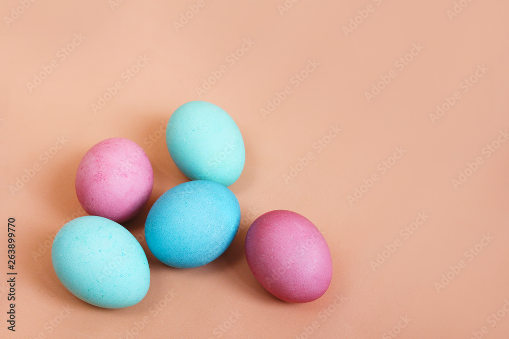 Multicolored easter eggs on bright pink background Multicolored easter eggs on bright pink background
