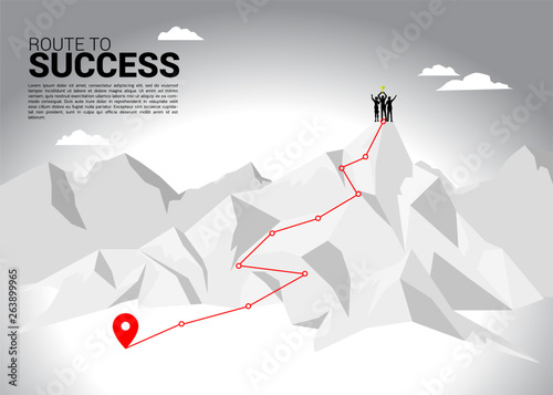 Silhouette of businessman and businesswoman with trophy on top of mountain. business concept of teamwork and championship. route to success