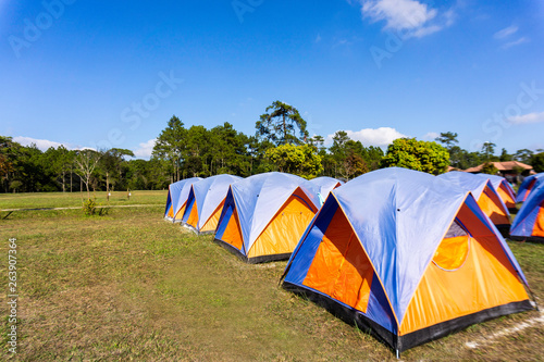 Camping and tent on mountain with blue sky background.