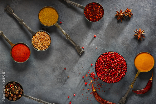 Fototapeta Naklejka Na Ścianę i Meble -  Wooden table of colorful spices