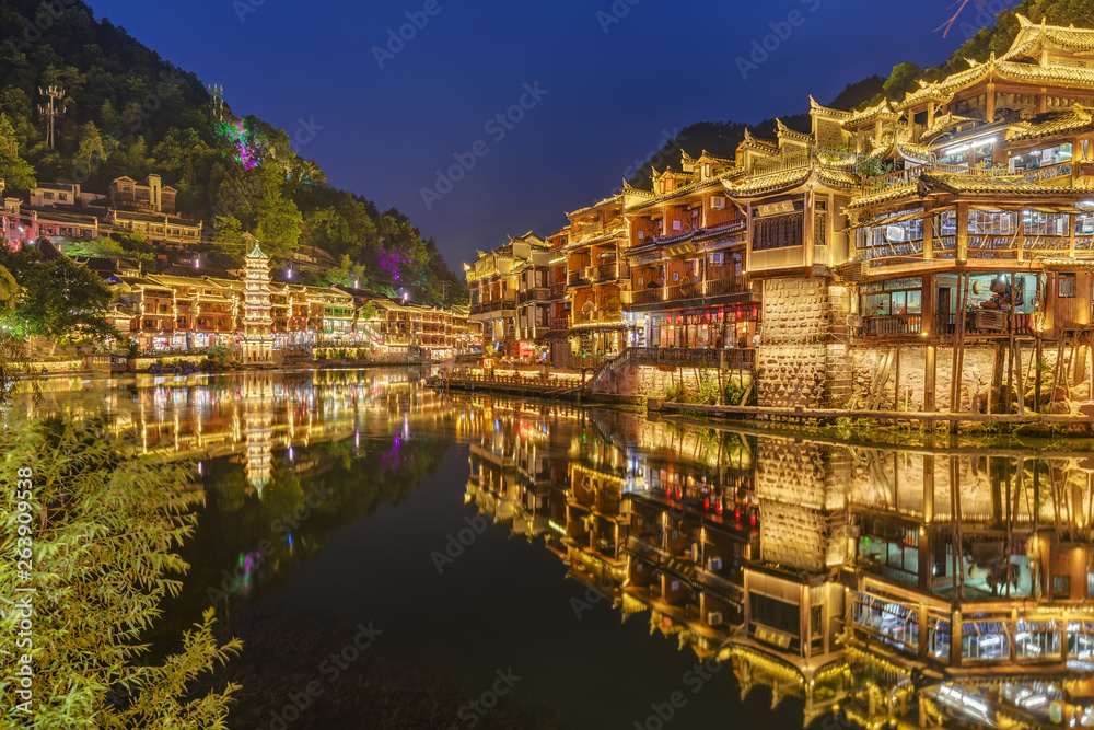 Fenghuang, China - May 29, 2018: Ancient town Fenghuang at sunset in Hunan