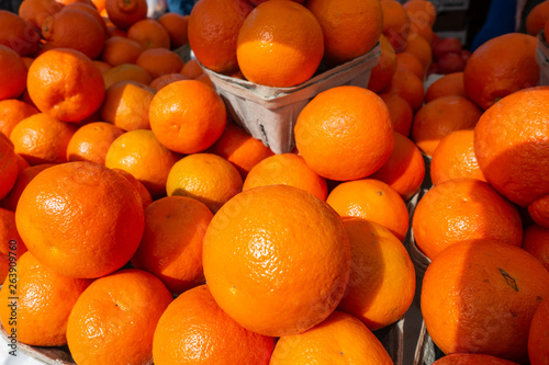 Florida oranges at a fruit and vegetable stand on a Saturday morning farmers market in Fort Pierce Florida.