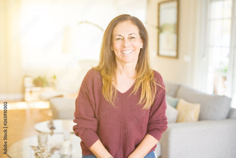 Beautiful middle age woman smiling at home Beautiful middle age woman smiling at home