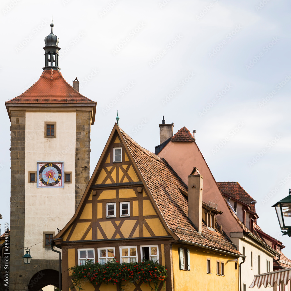 tower with clock and half timbered houses in Rothenburg ob der Tauber, Germany tower with clock and half timbered houses in Rothenburg ob der Tauber, Germany
