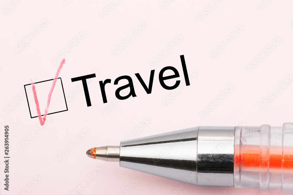 Travel - checkbox with a cross on white paper with pen. Checklist concept. Travel - checkbox with a cross on white paper with pen. Checklist concept.